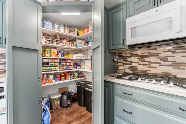 a view of appliances and cabinets