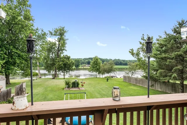 a view of a lake with a house in the background