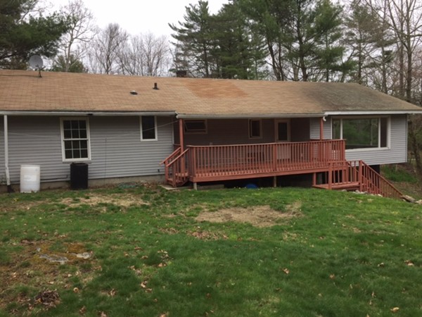 485 Wilsonville Road Thompson, CT 06277 - Photo 17 of 19 a backyard of a house with lots of green space