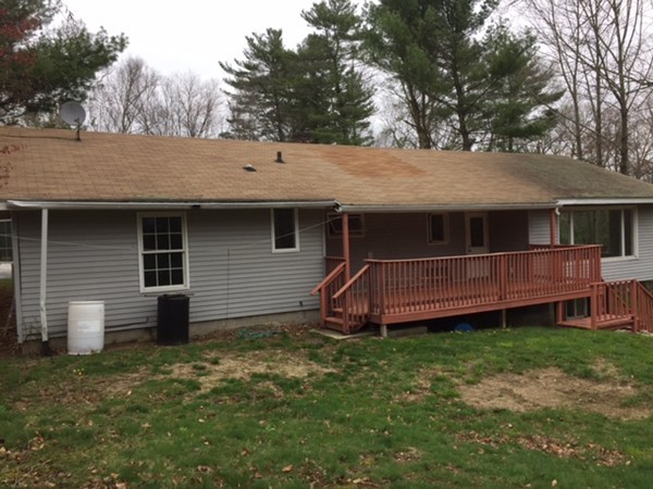 485 Wilsonville Road Thompson, CT 06277 - Photo 2 of 19 a front view of a house with a garden and yard