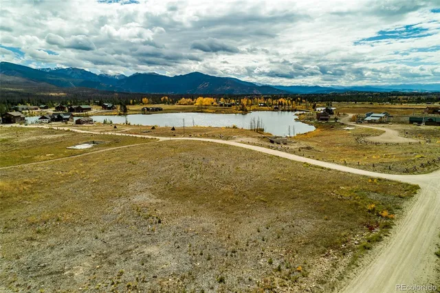 a view of a yard with snow on the road