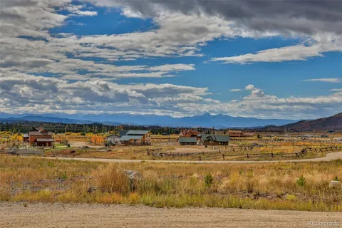 a view of a swimming pool with an outdoor seating