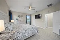 a view of walk in closet with clothes