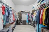 a bathroom with a granite countertop sink a mirror and a shower