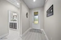 a view of a room that has a sink and a window