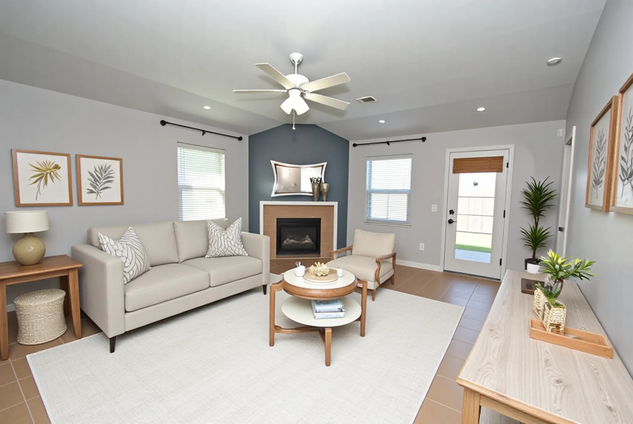 16427 Kettlebrook Lane Houston, TX 77049 - Photo 11 of 27 a living room with furniture a window and a fireplace