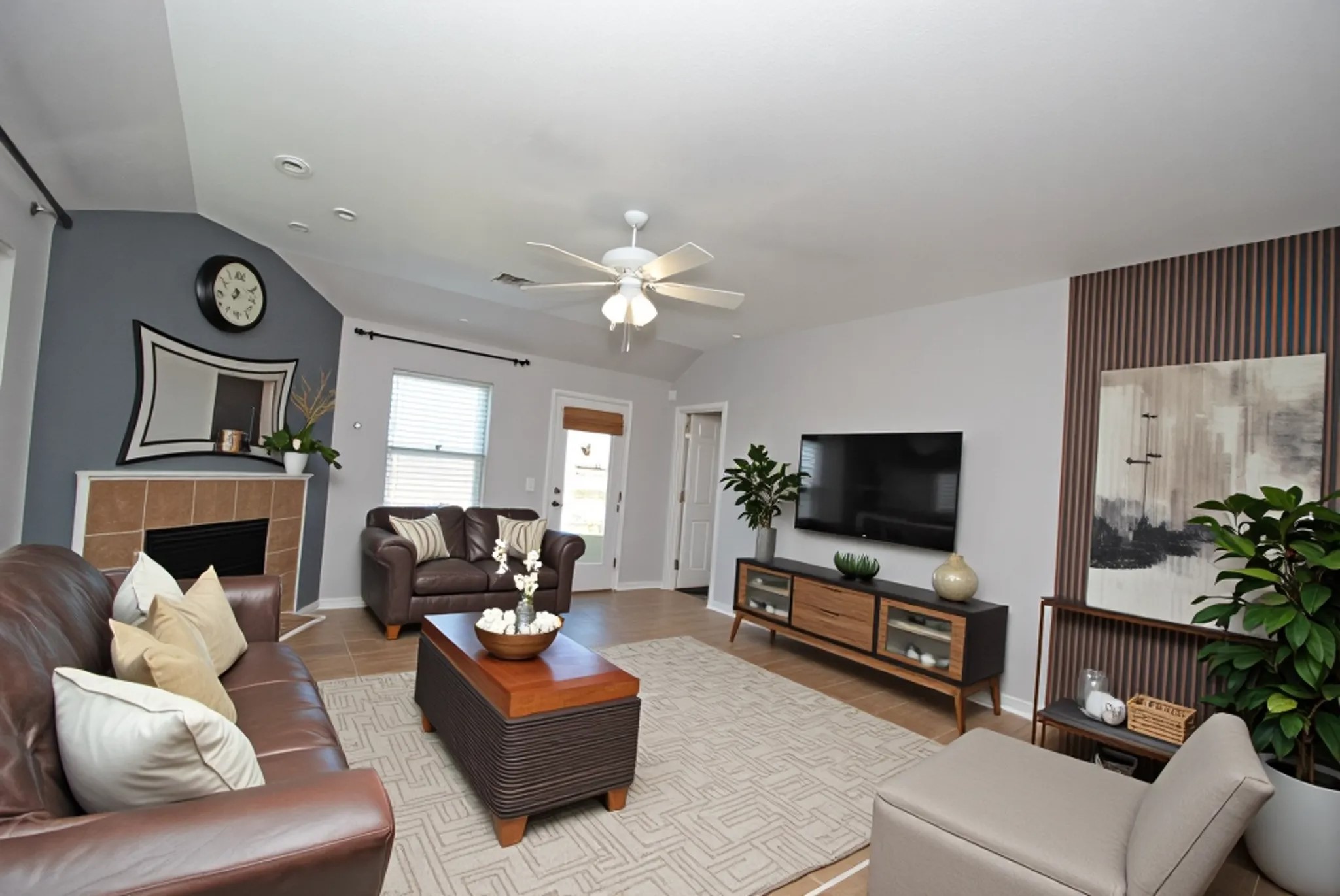 16427 Kettlebrook Lane Houston, TX 77049 - Photo 13 of 27 a living room with furniture and a flat screen tv