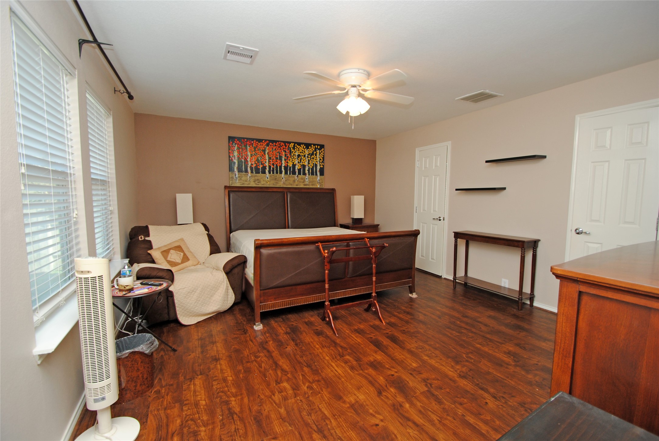 16427 Kettlebrook Lane Houston, TX 77049 - Photo 14 of 27 a bed room with furniture and a wooden floor