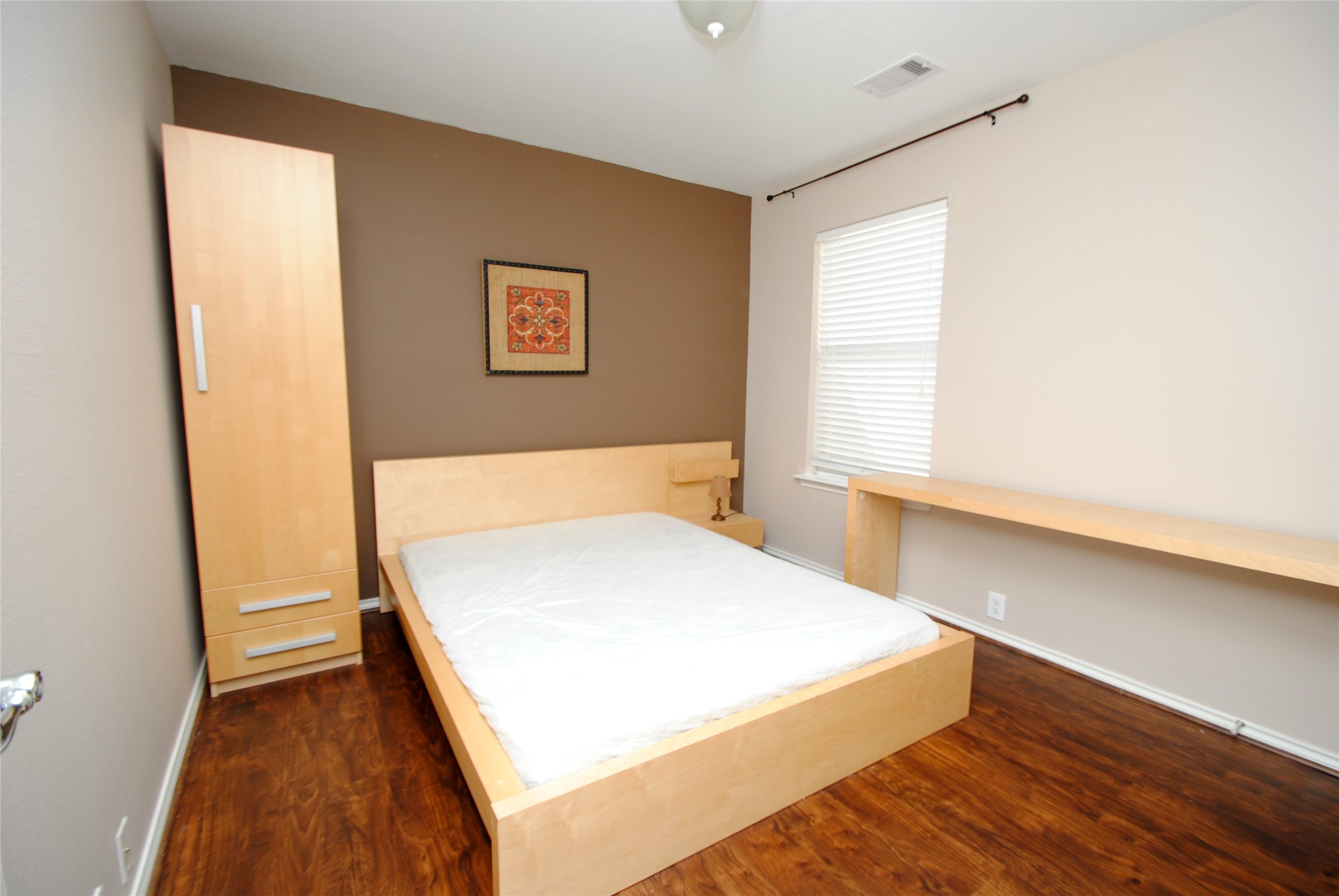 16427 Kettlebrook Lane Houston, TX 77049 - Photo 20 of 27 a room with a bed and a window