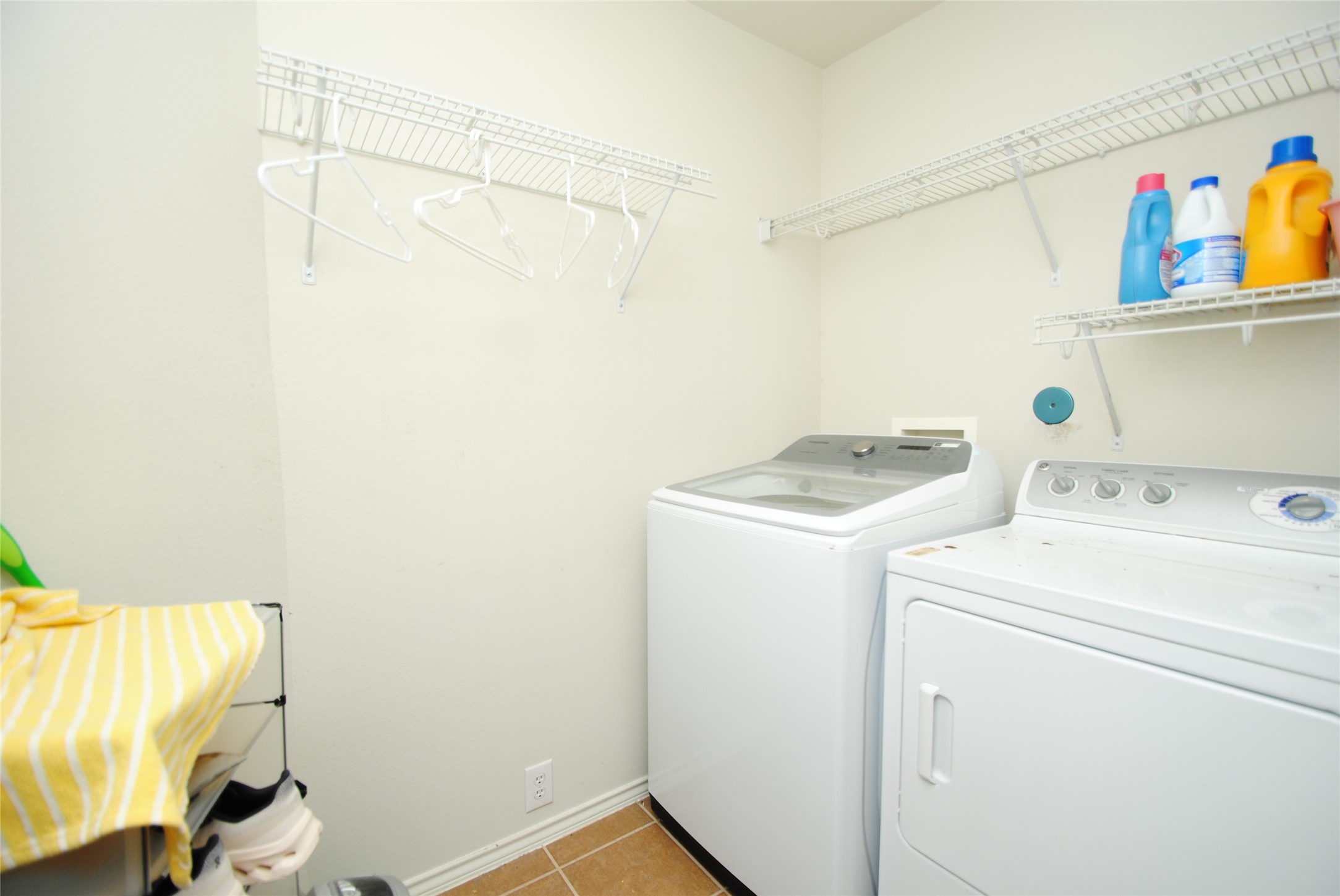 16427 Kettlebrook Lane Houston, TX 77049 - Photo 24 of 27 a utility room with dryer and washer