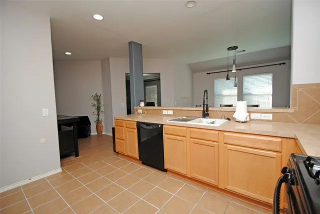a spacious bathroom with a double vanity sink a mirror and a shower