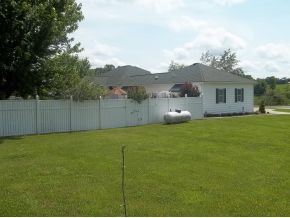 211 Reedy Ridge Clintwood, VA 24228 - Photo 21 of 23 REAR OF HOUSE WITH FENCE