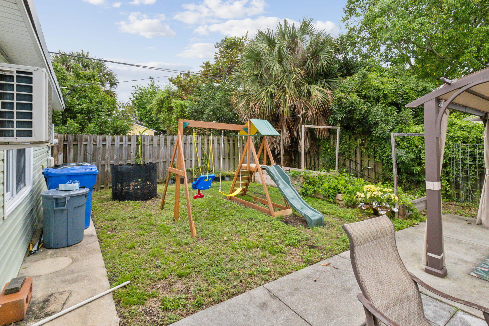 614 North 7th Street, Unit 1/2 Lantana, FL 33462 - Photo 16 of 18 a view of a chair and table in the patio