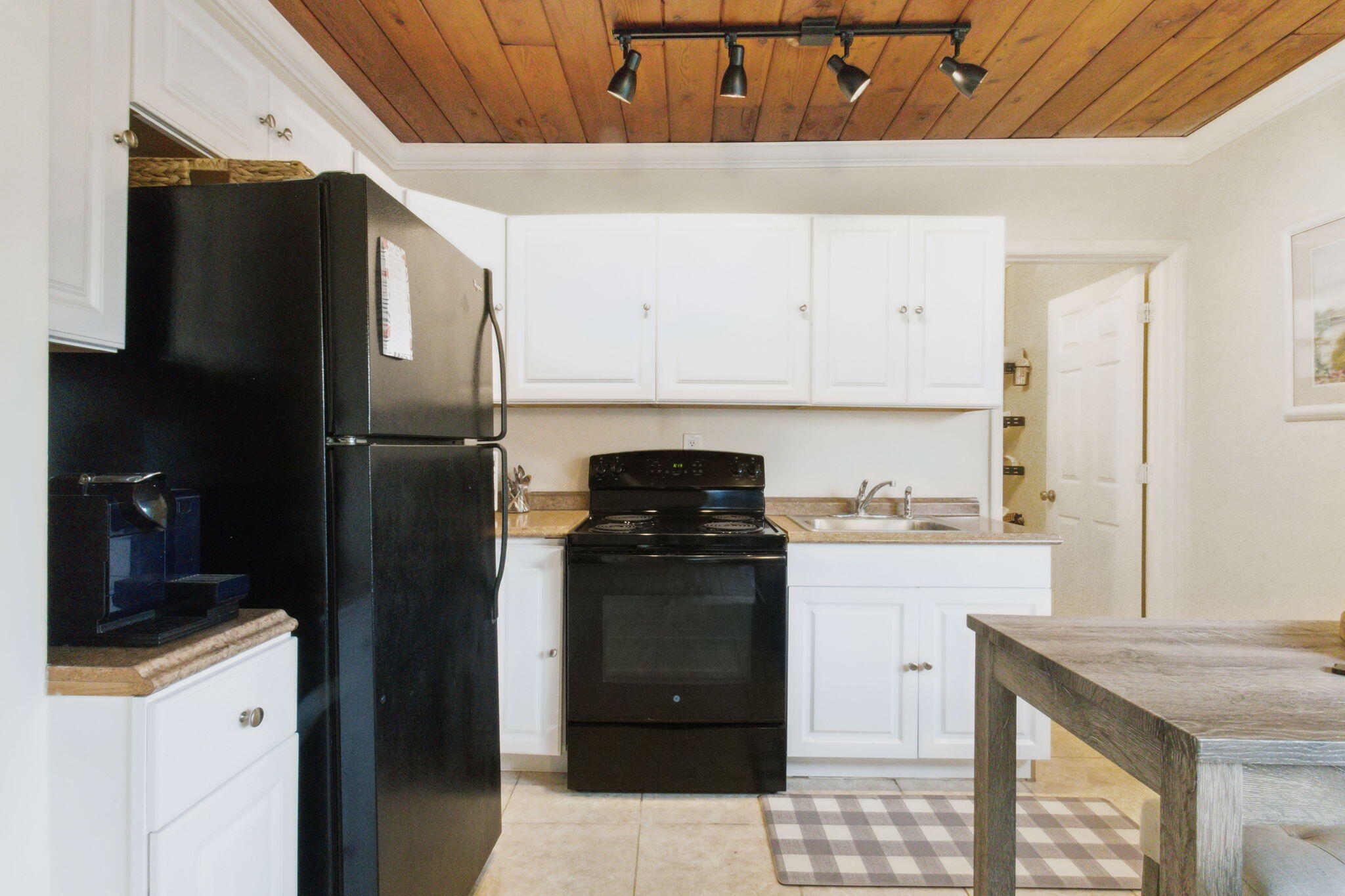 614 North 7th Street, Unit 1/2 Lantana, FL 33462 - Photo 10 of 18 a kitchen with a refrigerator and a stove