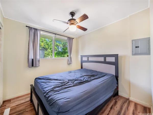 a bedroom with a bed and window