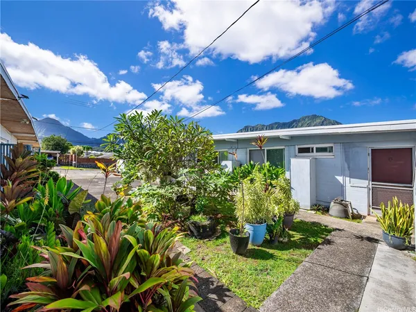 a view of a house with garden and plants