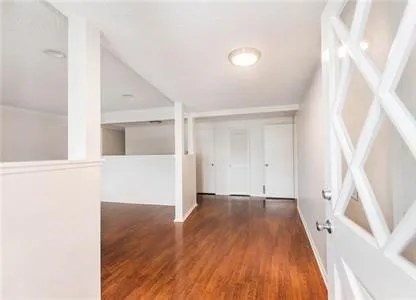 a view of a livingroom with wooden floor
