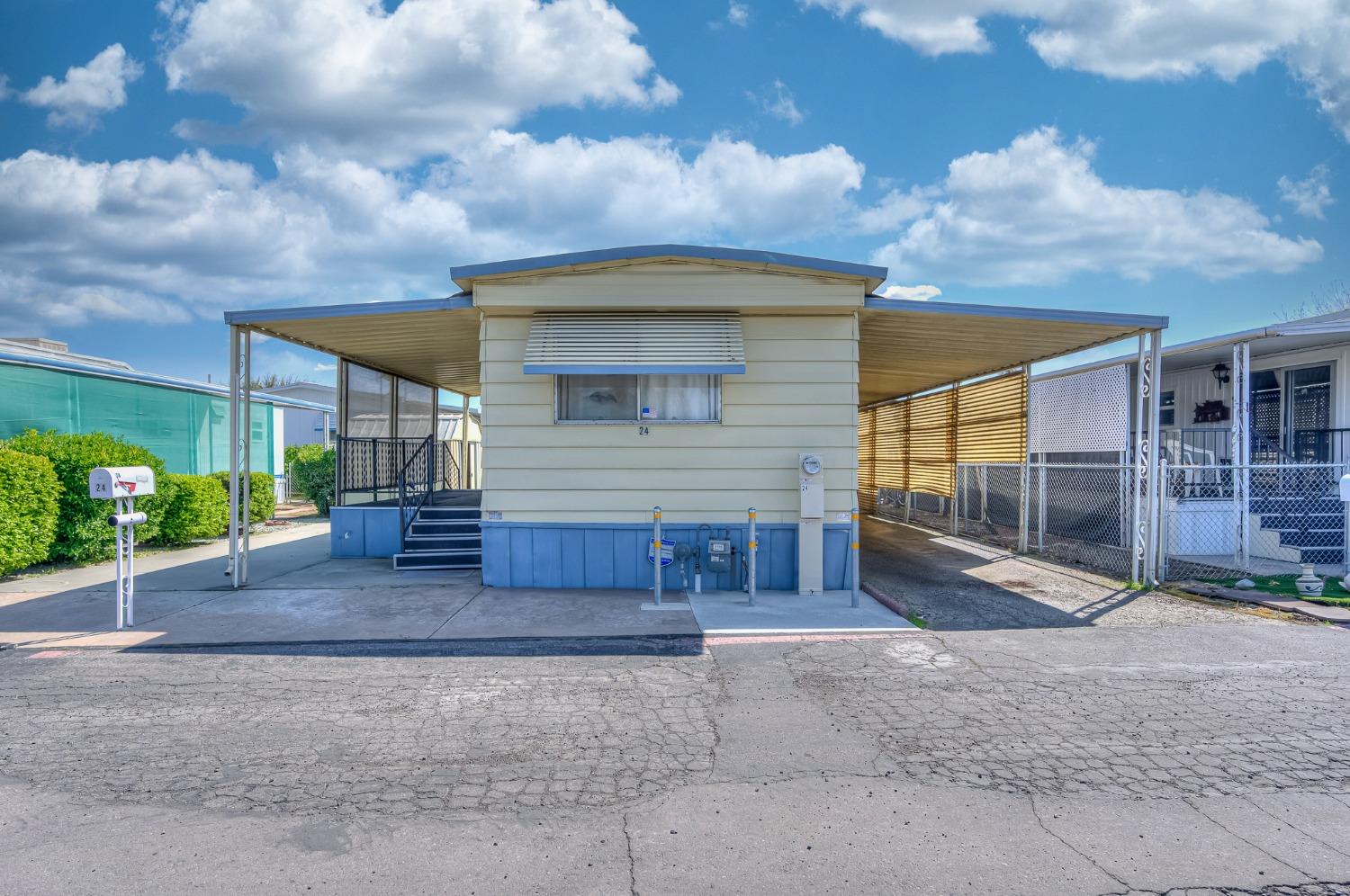 1272 Villa Avenue, Unit 24 Clovis, CA 93612 - Photo 1 of 21 a view of a house with backyard and garden