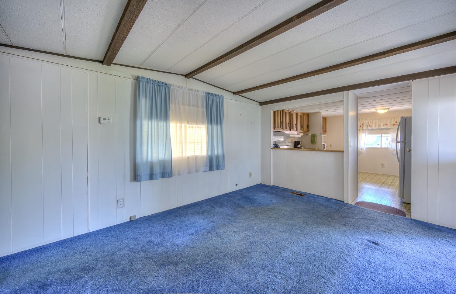 1272 Villa Avenue, Unit 24 Clovis, CA 93612 - Photo 8 of 21 wooden floor in an empty room with a window