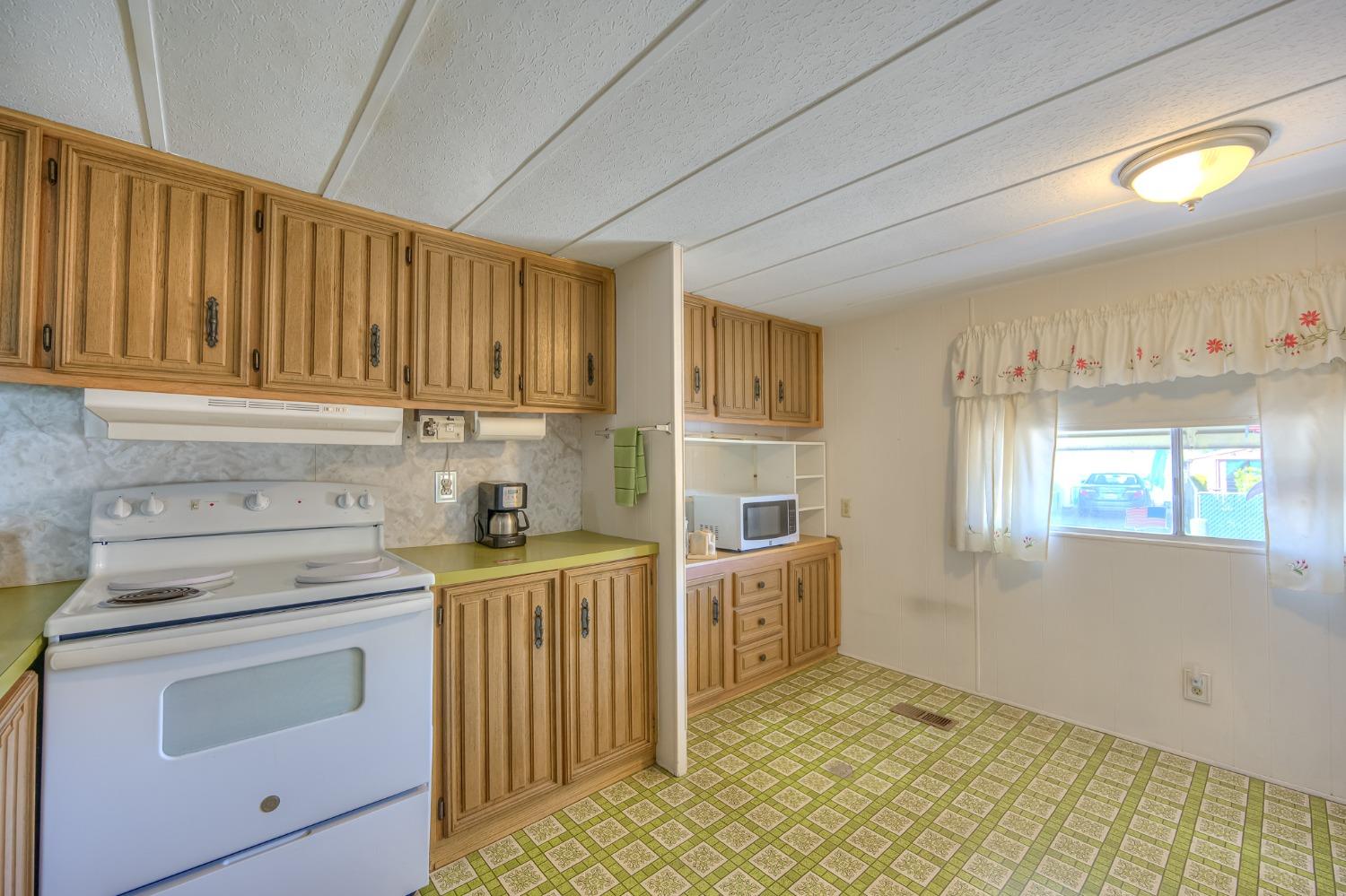 1272 Villa Avenue, Unit 24 Clovis, CA 93612 - Photo 10 of 21 a kitchen with a stove and a sink