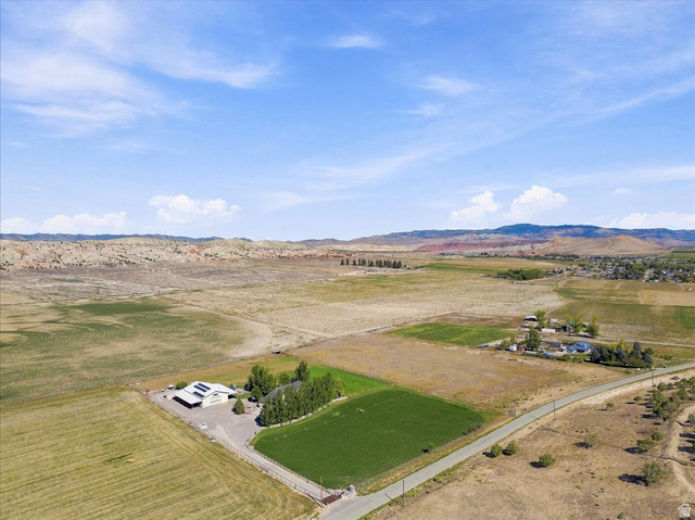 11290 South Southfield Road Mayfield, UT 84643 - Photo 7 of 103 Expansive property featuring a residence, detached structure, surrounding fields, and distant mountainous terrain