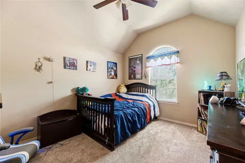 a bedroom with a bed and a chair