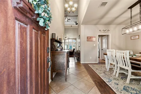 a view of kitchen with furniture and refrigerator