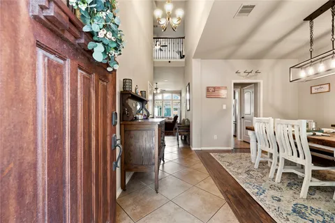 a view of kitchen with furniture and refrigerator
