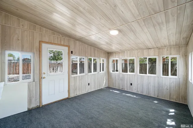 a bathroom with a tub shower and mirror