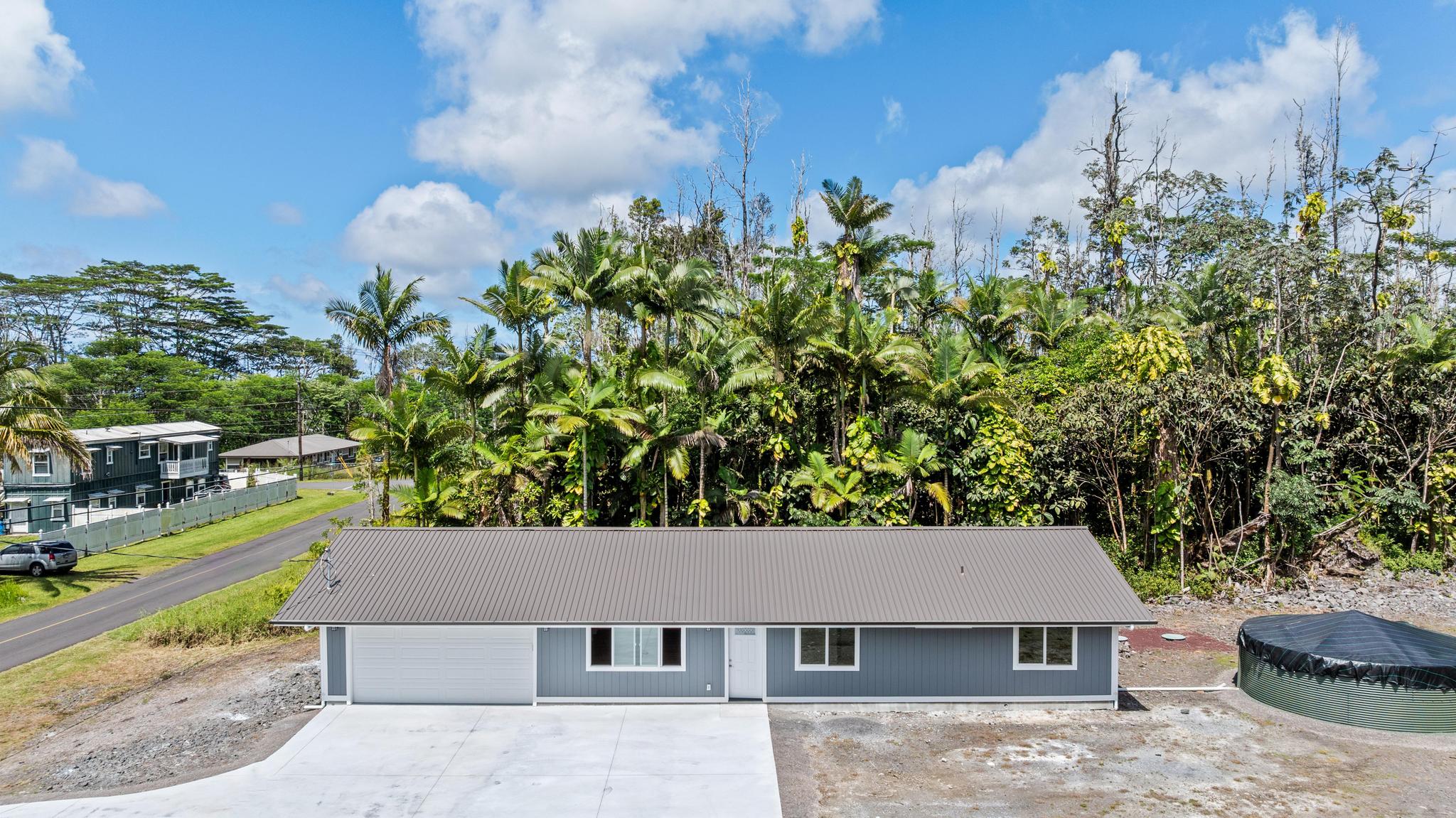 16-2579 Ainaloa Drive Pahoa, HI 96778 - Photo 1 of 30 front view of a house with a yard