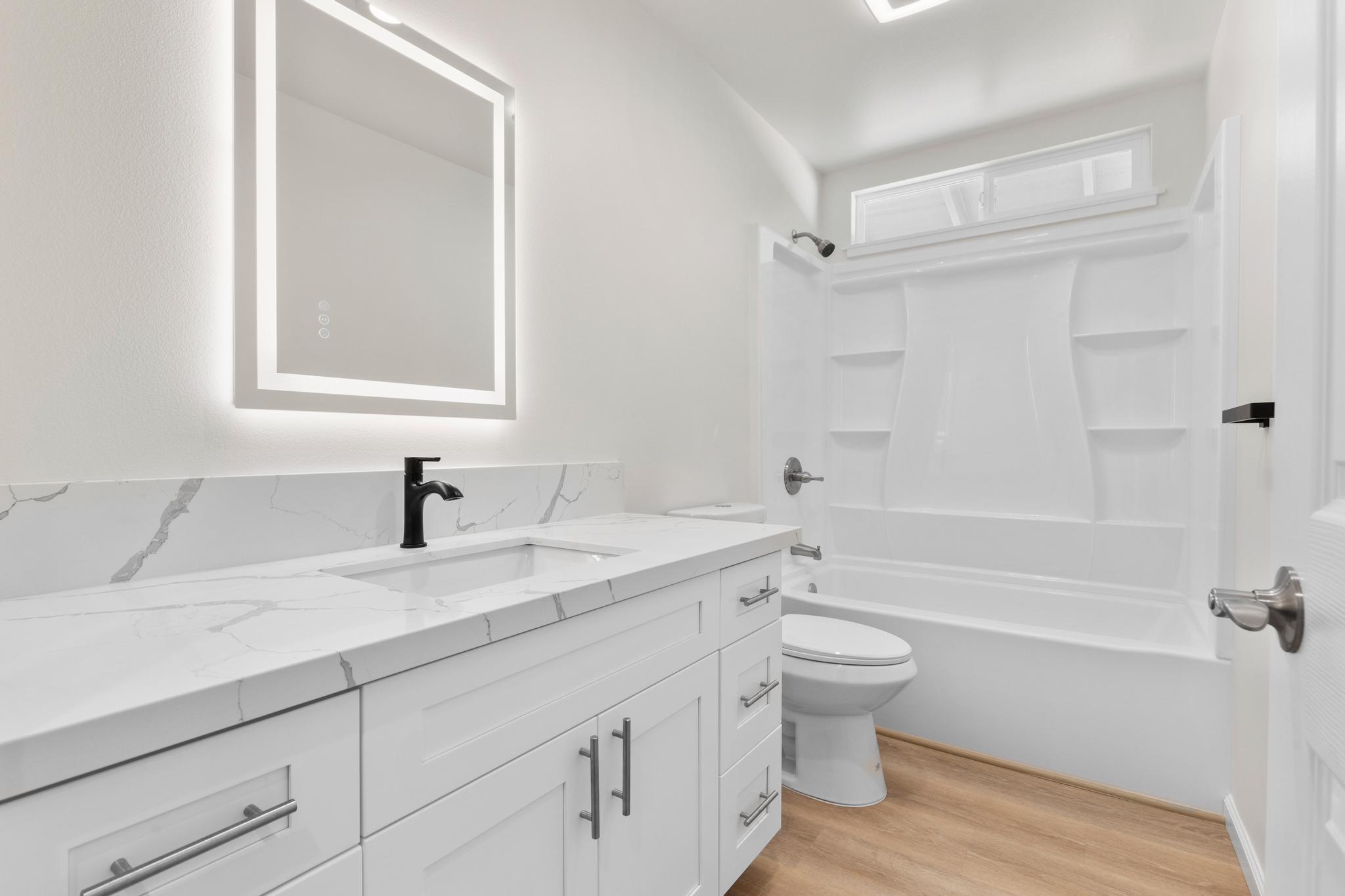 16-2579 Ainaloa Drive Pahoa, HI 96778 - Photo 13 of 30 a bathroom with a sink a toilet and shower