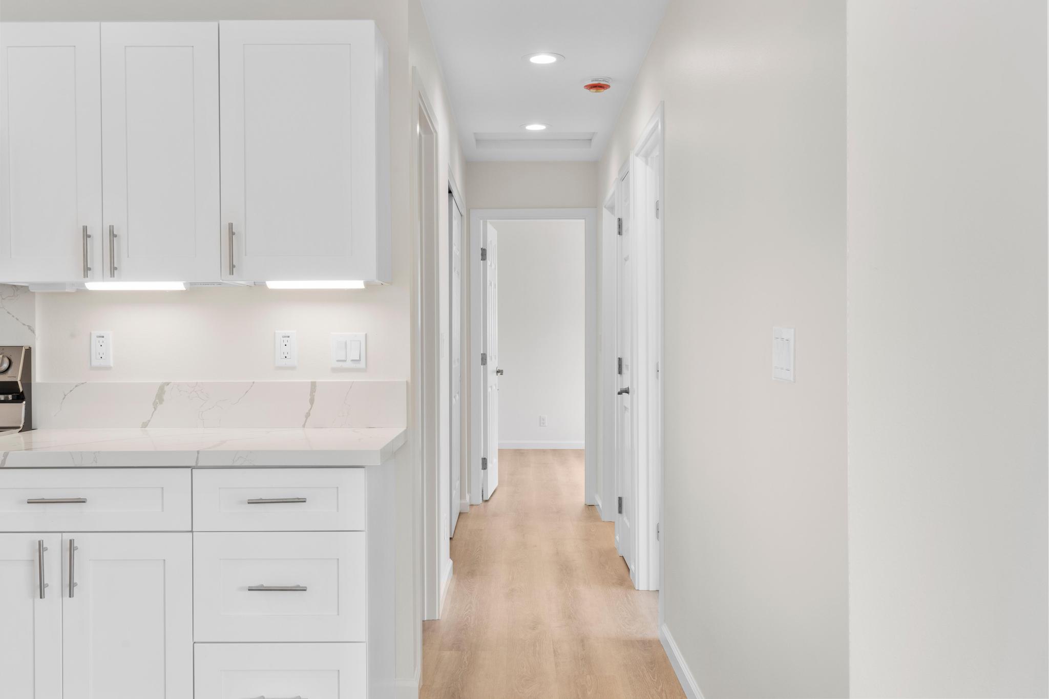 16-2579 Ainaloa Drive Pahoa, HI 96778 - Photo 16 of 30 a kitchen with white cabinets and a sink