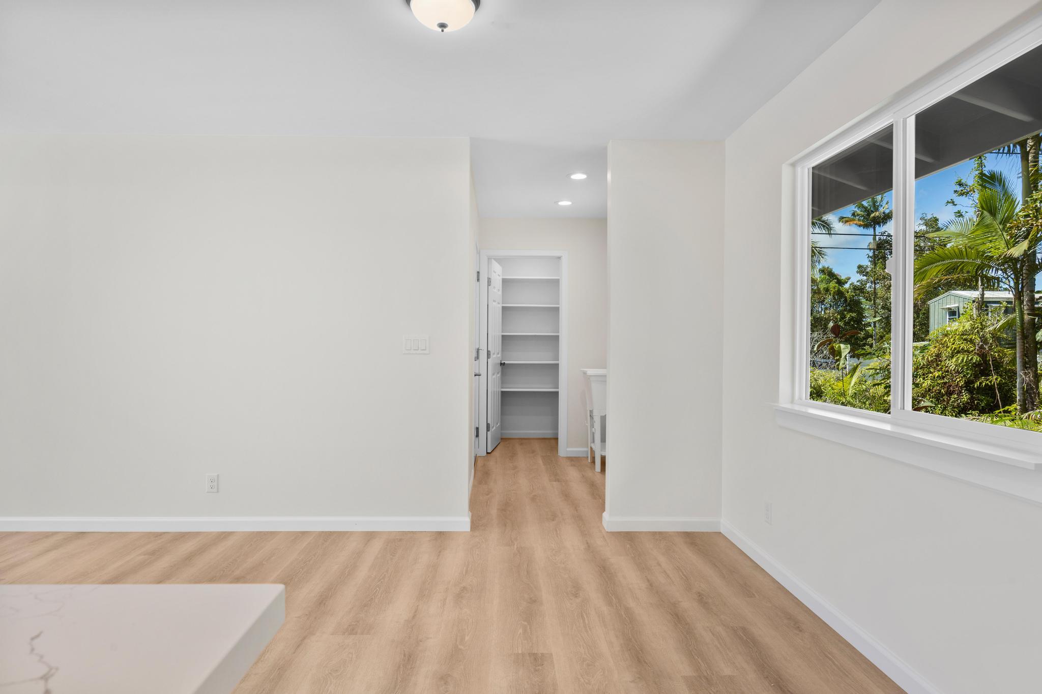 16-2579 Ainaloa Drive Pahoa, HI 96778 - Photo 21 of 30 a view of a room with wooden floor and natural light