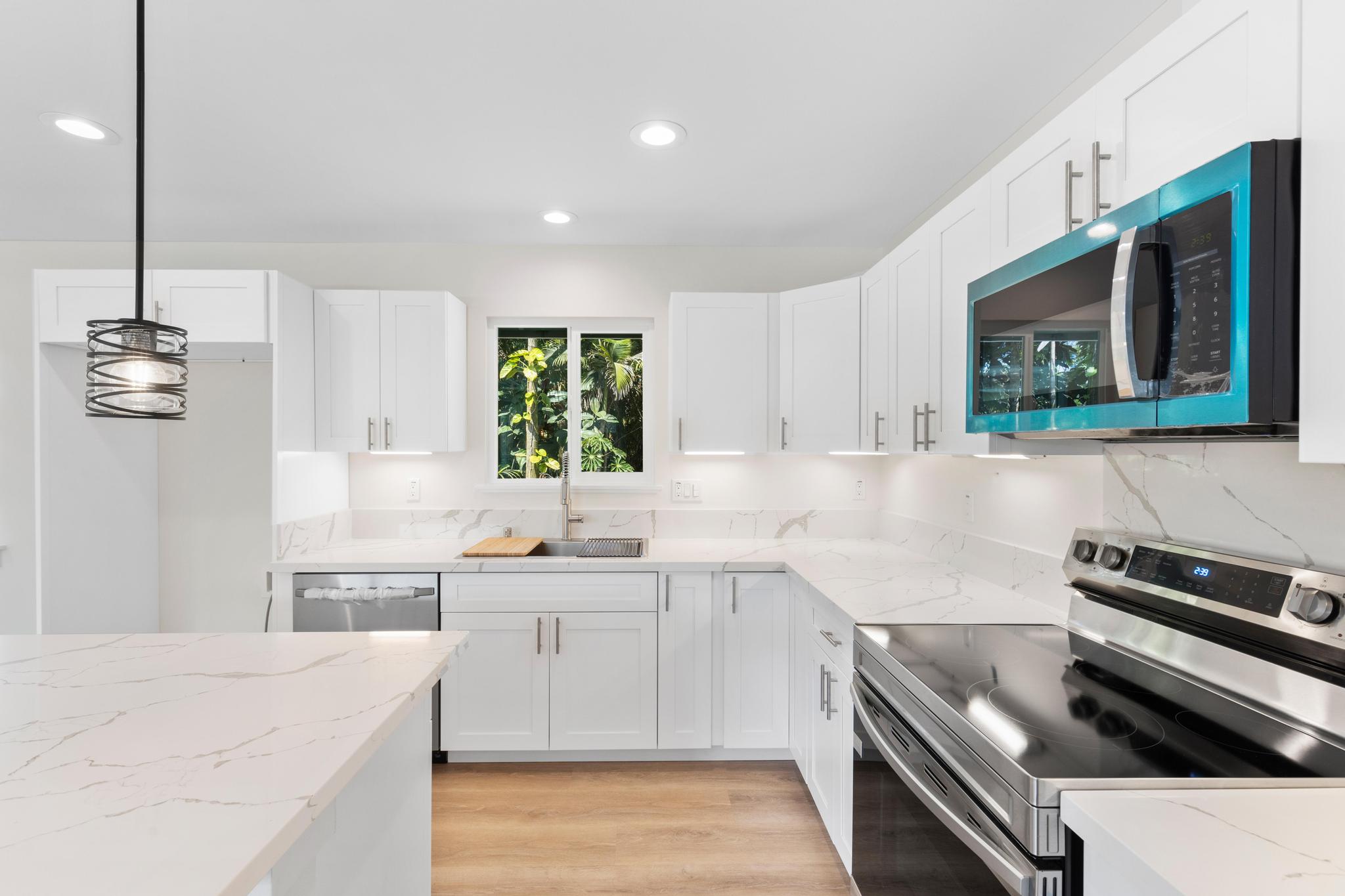 16-2579 Ainaloa Drive Pahoa, HI 96778 - Photo 5 of 30 a kitchen with a sink stove and microwave