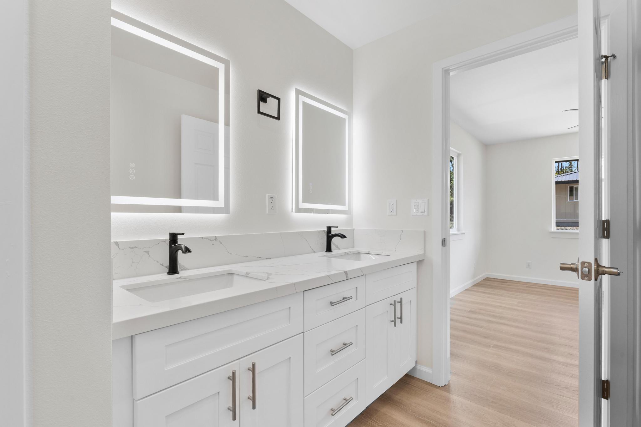 16-2579 Ainaloa Drive Pahoa, HI 96778 - Photo 9 of 30 a bathroom with a double vanity sink mirror and