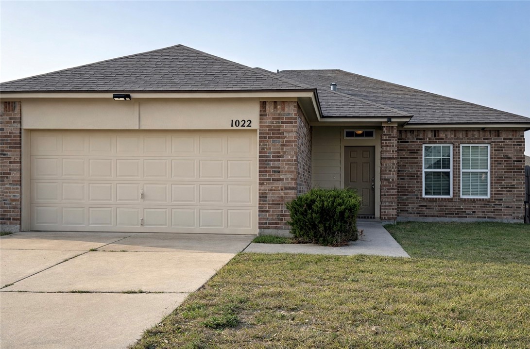 1022 Livermore Street Portland, TX 78374 - Photo 1 of 14 a front view of a house with a yard