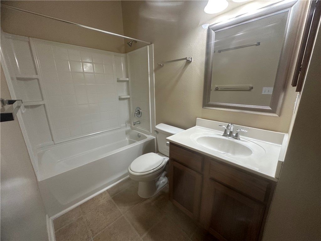 1022 Livermore Street Portland, TX 78374 - Photo 12 of 14 a bathroom with a sink toilet and shower