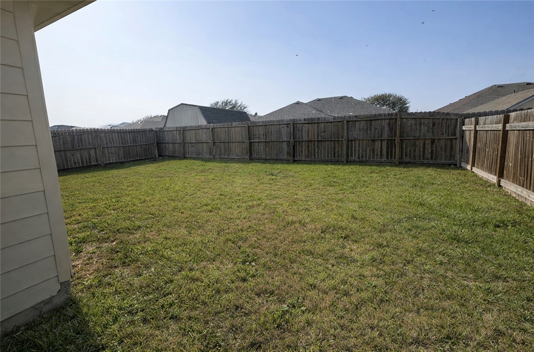 1022 Livermore Street Portland, TX 78374 - Photo 14 of 14 a view of a backyard