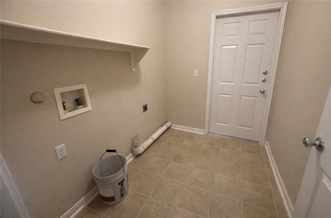 1022 Livermore Street Portland, TX 78374 - Photo 6 of 14 a bathroom with a toilet and a shower