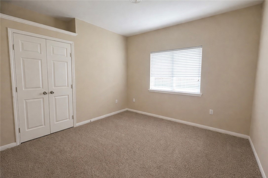 1022 Livermore Street Portland, TX 78374 - Photo 7 of 14 an empty room with a window