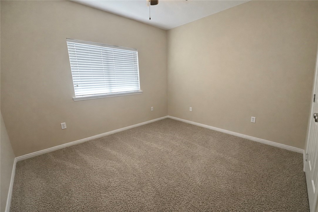 1022 Livermore Street Portland, TX 78374 - Photo 8 of 14 an empty room with a window