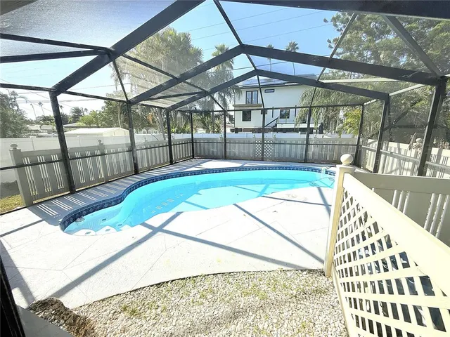 a view of a chairs and table in the balcony