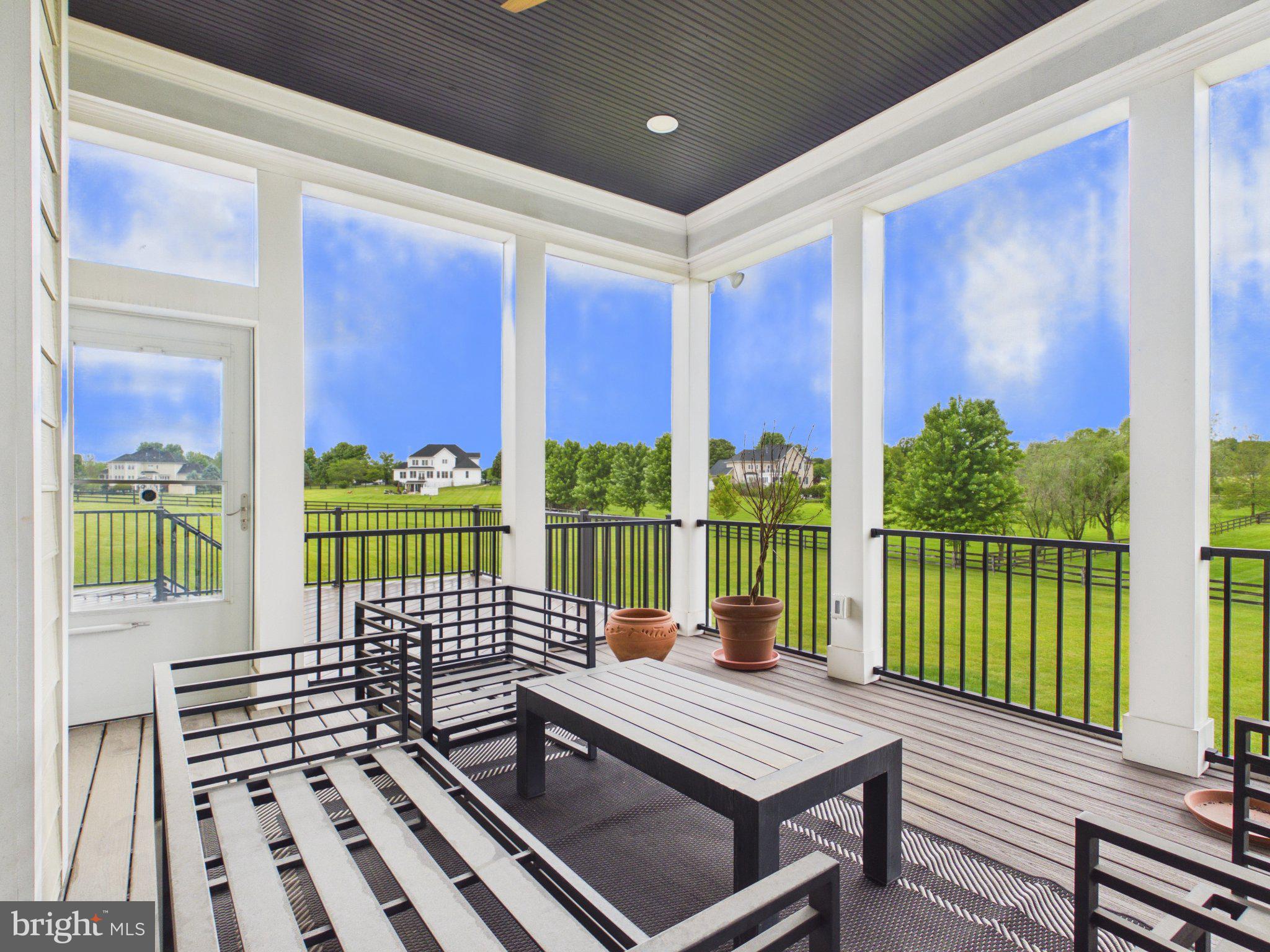 38565 Piggott Bottom Road Hamilton, VA 20158 - Photo 63 of 85 a view of a balcony with two chairs and a table