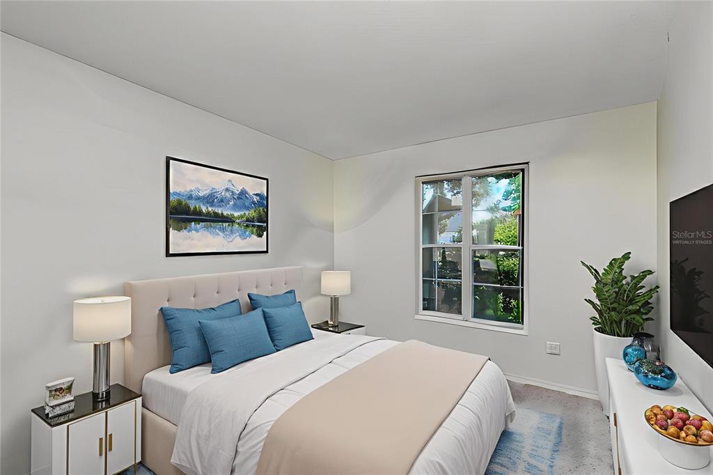 1432 Windmill Pointe Road Palm Harbor, FL 34685 - Photo 12 of 44 a bedroom with bed and a window