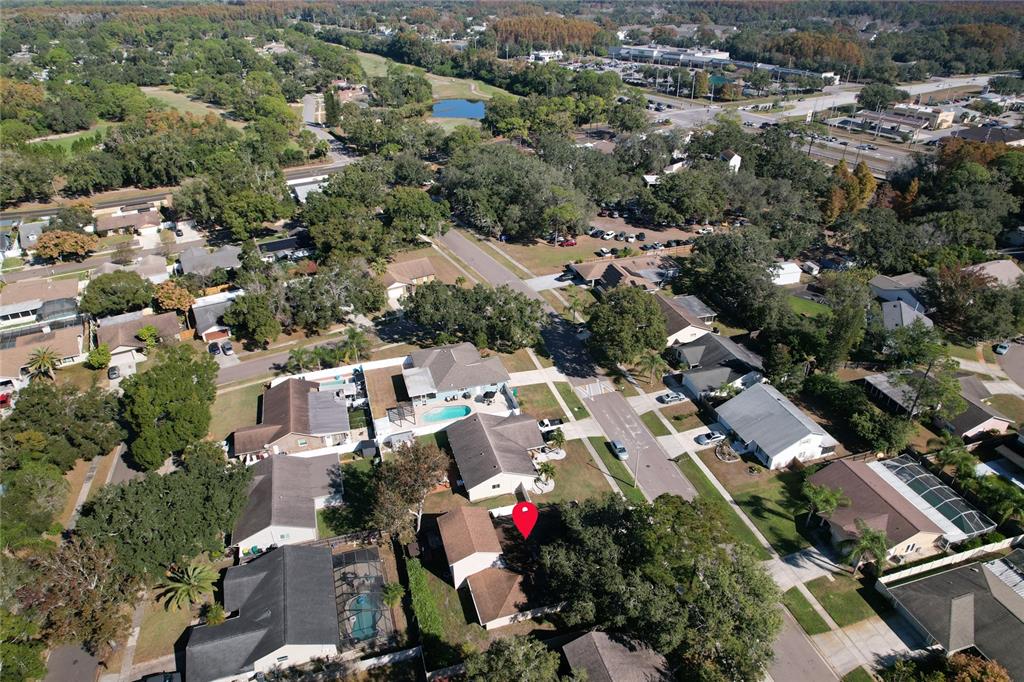 1432 Windmill Pointe Road Palm Harbor, FL 34685 - Photo 25 of 44 an aerial view of residential houses with green space