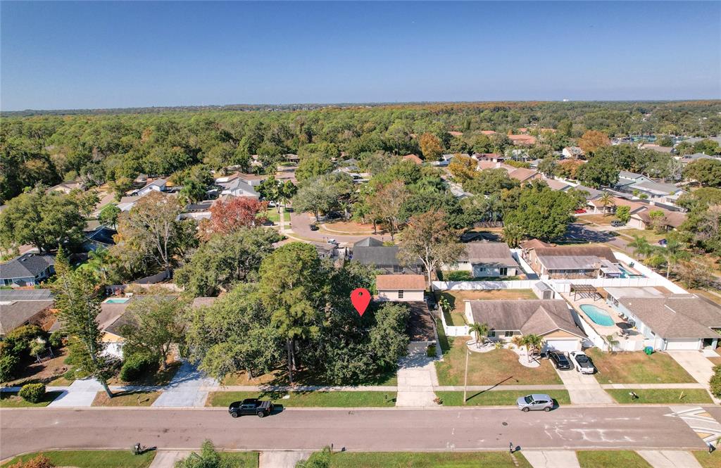 1432 Windmill Pointe Road Palm Harbor, FL 34685 - Photo 26 of 44 an aerial view of residential houses with outdoor space