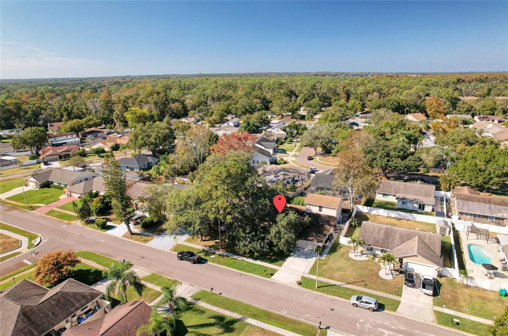 1432 Windmill Pointe Road Palm Harbor, FL 34685 - Photo 27 of 44 an aerial view of residential houses with outdoor space