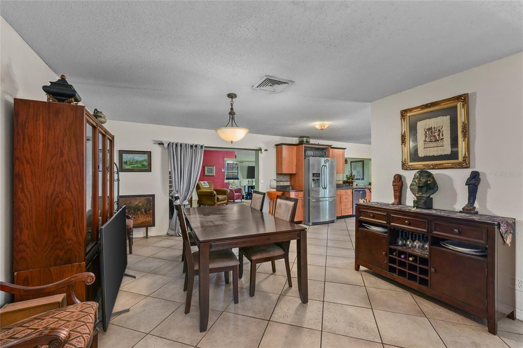 1432 Windmill Pointe Road Palm Harbor, FL 34685 - Photo 32 of 44 a view of a dining room with furniture