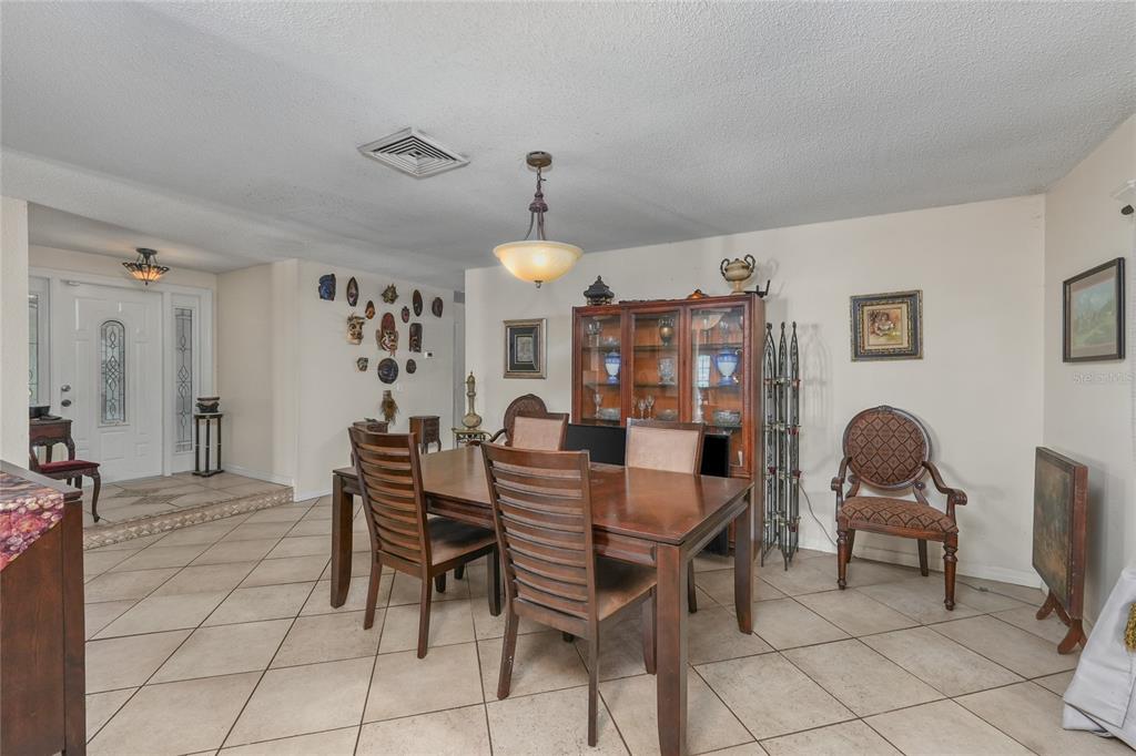 1432 Windmill Pointe Road Palm Harbor, FL 34685 - Photo 33 of 44 a view of a dining room with furniture