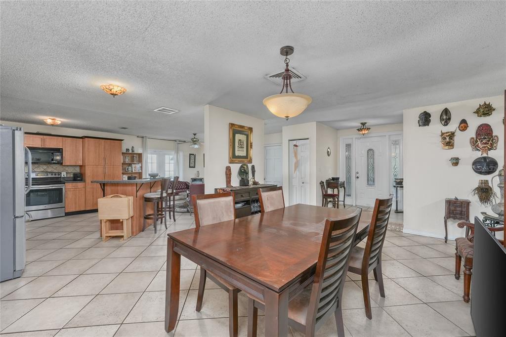 1432 Windmill Pointe Road Palm Harbor, FL 34685 - Photo 34 of 44 a view of a dining room with furniture